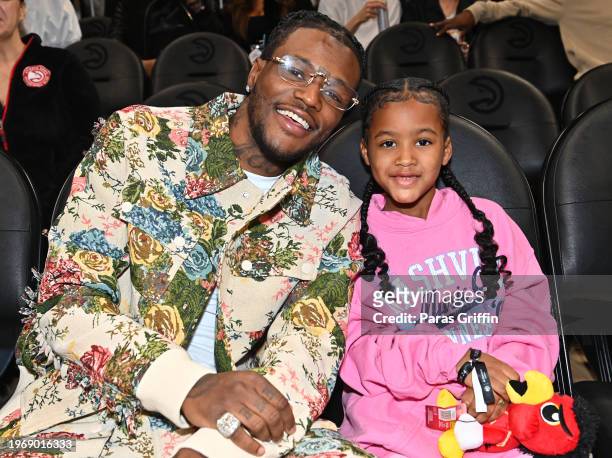 Actor/comedian D.C. Young Fly and his daughter Nova Whitfield attend the game between the Toronto Raptors and the Atlanta Hawks at State Farm Arena...