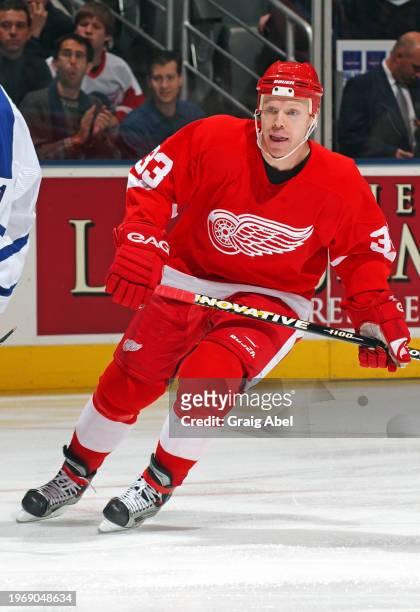 Kris Draper of Detroit Red Wings skates against the Toronto Maple Leafs during NHL game action on December 6, 2003 at Air Canada Centre in Toronto,...