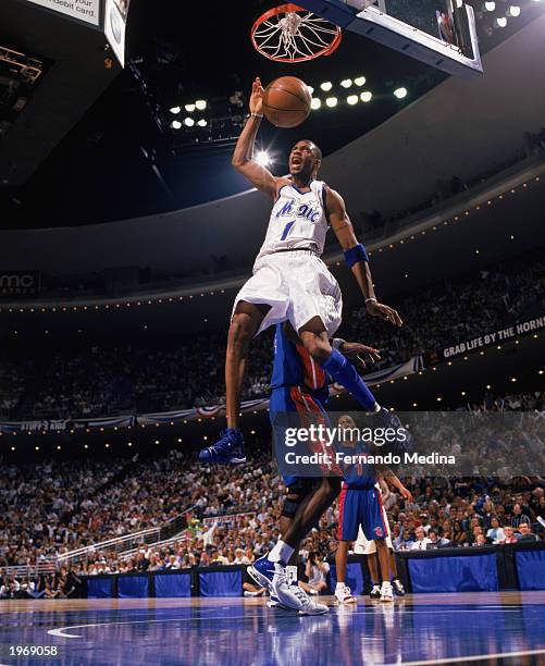 Tracy McGrady of the Orlando Magic finishes the dunk against the News  Photo - Getty Images