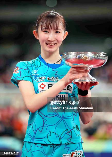 Hina Hayata poses with the trophy after her victory against Miwa Harimoto in the Women's Singles final on day seven of the All Japan Table Tennis...