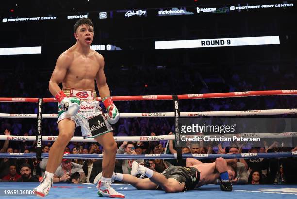 Jaime Munguia of Mexico reacts after knocking down John Ryder of Great Britain during the WBC silver super middleweight title fight at Footprint...