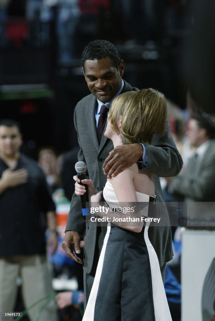Maurice Cheeks helps Natalie Gilbert sing the National Anthem 