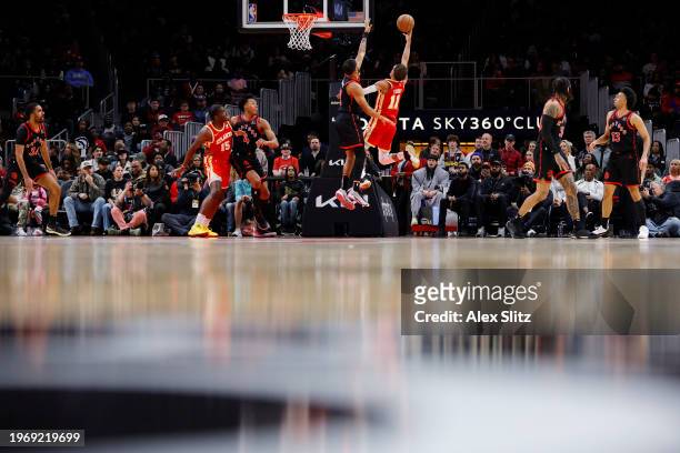 Trae Young of the Atlanta Hawks shoots against Bruce Brown of the Toronto Raptors during the second half at State Farm Arena on January 28, 2024 in...