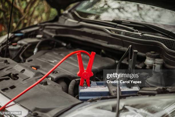 charging car battery with cocrodrile clips - jump start stock pictures, royalty-free photos & images