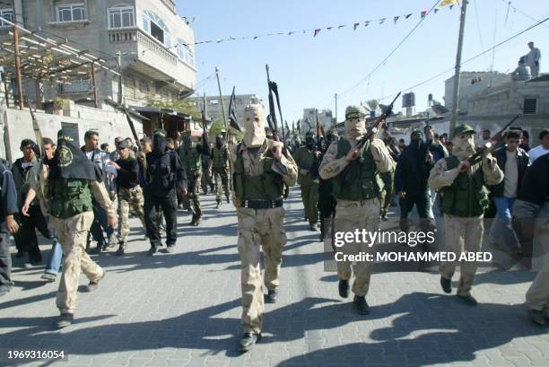 Masked members of Islamic Jihad's armed wing Saraya al-Quds, or Jerusalem Battalions, march in Jabalia refugee camp in the northern Gaza Strip, 02...