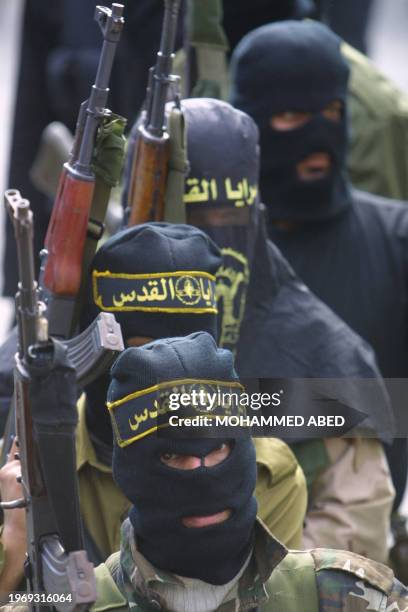 Masked members of Islamic Jihad's armed wing Saraya al-Quds, or Jerusalem Battalions, march in Jabalia refugee camp in the northern Gaza Strip, 02...