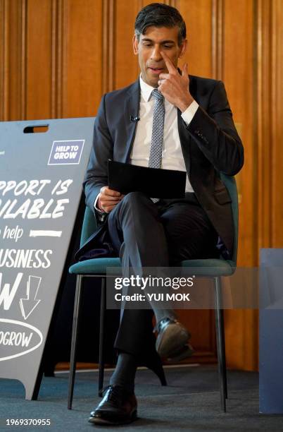 Britain's Prime Minister Rishi Sunak reacts during the Help To Grow campaign launch panel event with business leaders from small and medium...