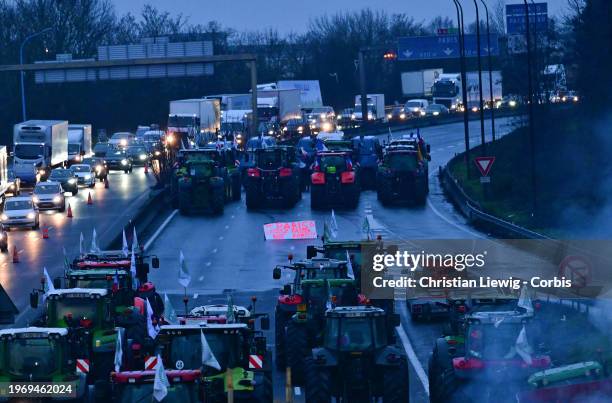 Protesting farmers blockade the A6 autoroute with tractors on February 1, 2024 in Chilly-Mazarin, France. French farmers choked off main highways...