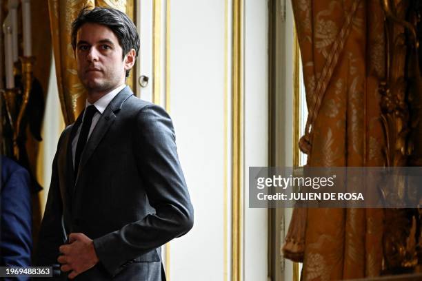 French Prime Minister Gabriel Attal looks on before a press conference at the Hotel Matignon, in Paris, on February 1 to answer to farmers protesting...
