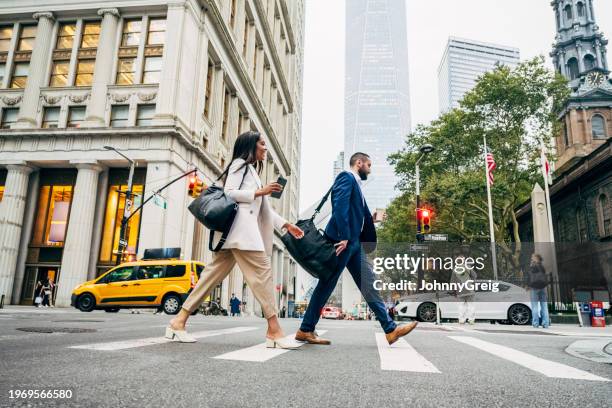 new york business professionals crossing fulton on broadway - new york rush hour stock pictures, royalty-free photos & images