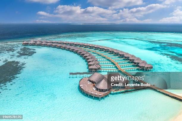 maldives paradise scenery. tropical aerial landscape, seascape with long jetty, water villas with amazing sea and lagoon beach, tropical nature. exotic tourism destination banner, summer vacation - luxury hotel island stock pictures, royalty-free photos & images