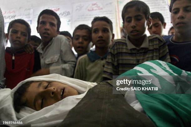 Palestinian relatives and friends of nine-year-old Omar Mohammed Abu Zreihan, mourn during his funeral in Rafah refugee camp southern Gaza Strip, 01...