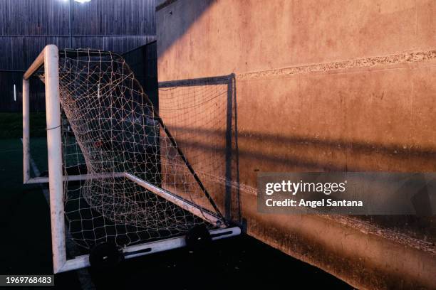 abandoned soccer goal post at sunset - team sport australia stock pictures, royalty-free photos & images