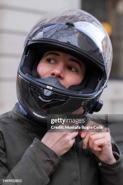 woman wearing motorbike helmet - sports helmet stock pictures, royalty-free photos & images