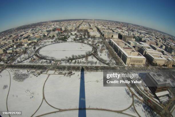 washington monument noon snow shadow (fisheye) - washington monument dc stock pictures, royalty-free photos & images