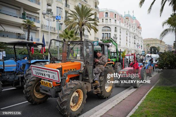 Farmers line-up in their tractor as they demonstrate on the "Promenade des Anglais" on the French riviera city of Nice on February 1 as part of...