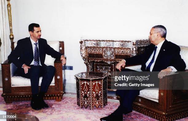 In this photograph provided by the Syrian news agency SANA, Syrian President Bashar al-Assad talks with U.S. Secretary of State Colin Powell May 3,...