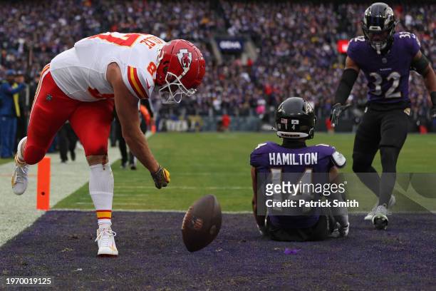 Travis Kelce of the Kansas City Chiefs celebrates after catching a touchdown pass against the Baltimore Ravens during the first quarter in the AFC...