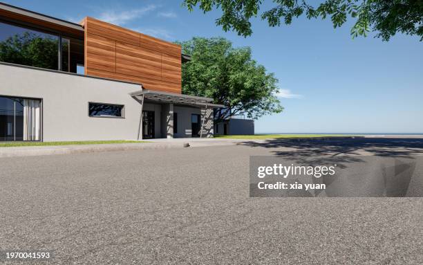 asphalt road against modern house with sea horizon - asphalt paver stock pictures, royalty-free photos & images