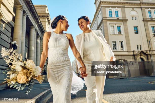 lgbtqia couple celebrating their love with an elopement wedding in the city. - wedding ceremony city hall stock pictures, royalty-free photos & images