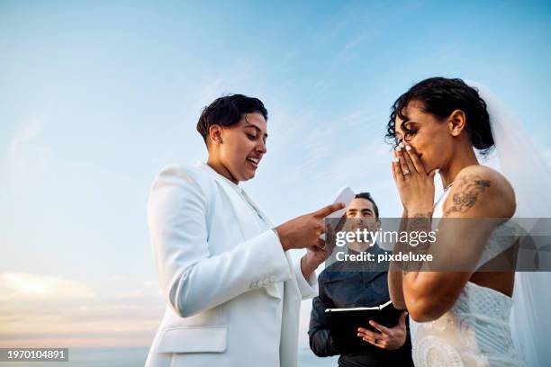 lgbtqia couple celebrating their love with an elopement wedding in a beautiful setting. - wedding vows stock pictures, royalty-free photos & images