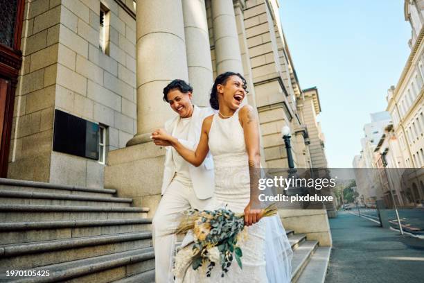 lgbtqia couple celebrating their love with an elopement wedding in the city. - wedding ceremony city hall stock pictures, royalty-free photos & images