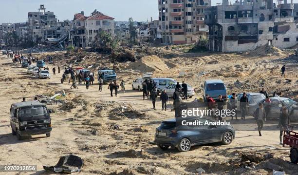 Hours after the Israeli army withdrew from the region, residents are seen arriving amid destruction to check their homes and properties that they had...