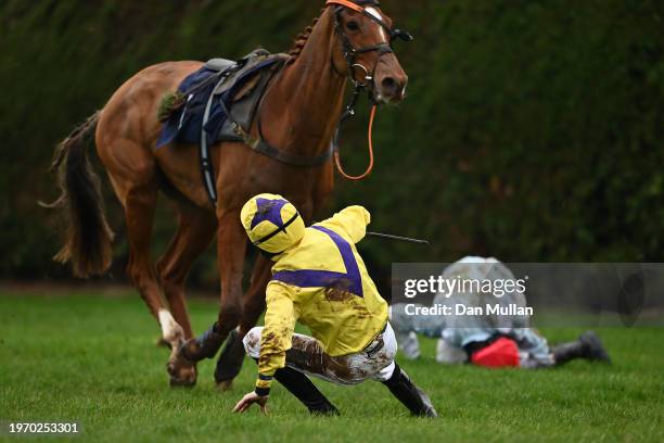 Ben Poste falls from Not Now Kanne alongside Luke Scott falling from Whizz Kid during the Download The PlanetSportBet App Handicap Hurdle at Hereford...