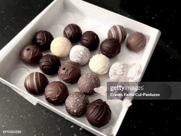 close-up of a box of chocolate - milk chocolate truffles stock pictures, royalty-free photos & images