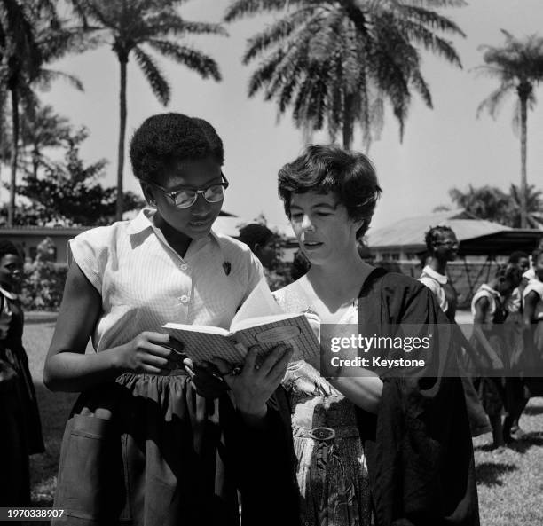 Principal Margaret Gentle discussing a problem with the head girl at Queen's College, a girls' boarding school in Lagos, Nigeria, June 1959. The...