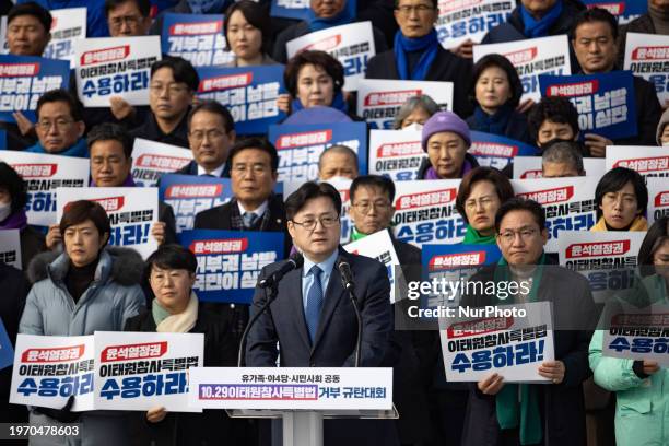 The Democratic Party's floor leader Hong Ihk-pyo is delivering a speech at a protest rally in front of the main building of the National Assembly in...