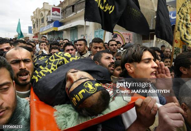 Relatives of Palestinian Islamic Jihad militant Mohammed Abu Khazneh mourn during his funeral in the northern West bank village of Nazlat al- Wusta,...