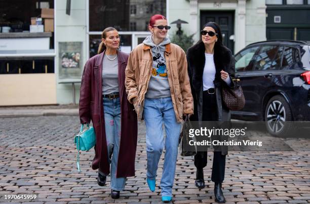 Janka Polliani wears burgundy coat, grey shirt, Chanel jeans with logo & Marianne Theodorsen wears brown jacket, hoody with Micky Mouse print, jeans...