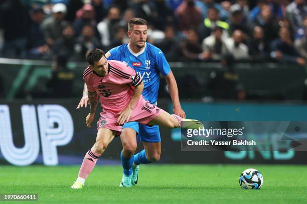 Lionel Messi of Inter Miami battles for possession with Sergej Milinkovic-Savic of Al Hilal during the Riyadh Season Cup match between Al Hilal and...