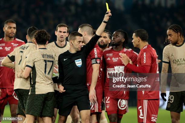 Kenny Lala of Brest receives a yellow card from Referee Clement Turpin during the Ligue 1 Uber Eats match between Paris Saint-Germain and Stade...