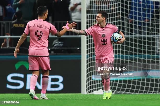 Lionel Messi of Inter Miami celebrates scoring his team's second goal from the penalty spot with teammate Luis Suarez after during the Riyadh Season...