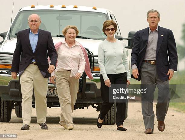 President George W. Bush first lady Laura Bush , Australian Prime Minister John Howard and Howard's wife, Janette walk down the road leading to...