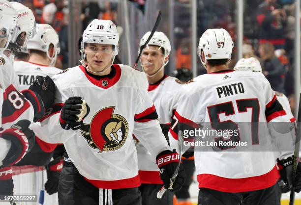 Tim Stutzle of the Ottawa Senators celebrates his empty net goal with teammates on the bench against the Philadelphia Flyers at the Wells Fargo...