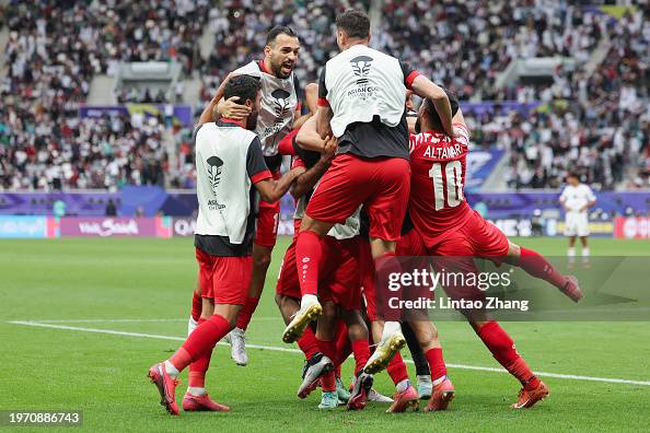 Nizar Al Rashdan of Jordan celebrates scoring his team's third goal ...