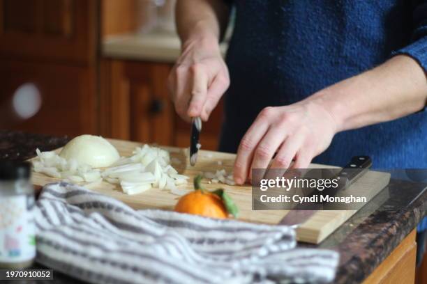 close up of a man's hands chopping onions - service of thanksgiving stock pictures, royalty-free photos & images