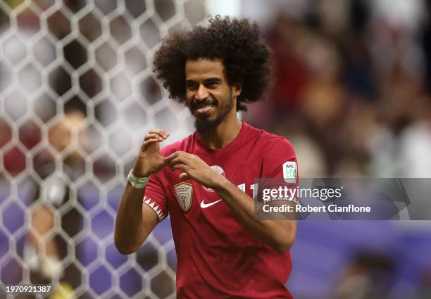 Akram Afif of Qatar celebrates scoring his team's second goal during the AFC Asian Cup Round of 16 match between Qatar and Palestine at Al Bayt...