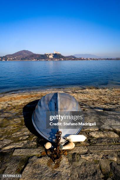 upside down boat and lake major with a fortress on a plateau on the horizon - mid distance stock pictures, royalty-free photos & images