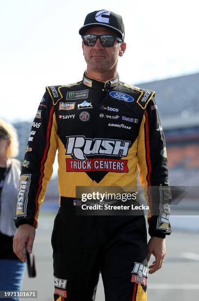 Clint Bowyer, driver of the Rush/Cummins Ford, walks the grid during qualifying for the Monster Energy NASCAR Cup Series Bank of America ROVAL 400 at...