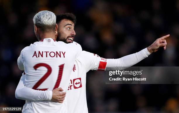 Bruno Fernandes of Manchester United celebrates scoring his team's first goal with teammate Antony during the Emirates FA Cup Fourth Round match...