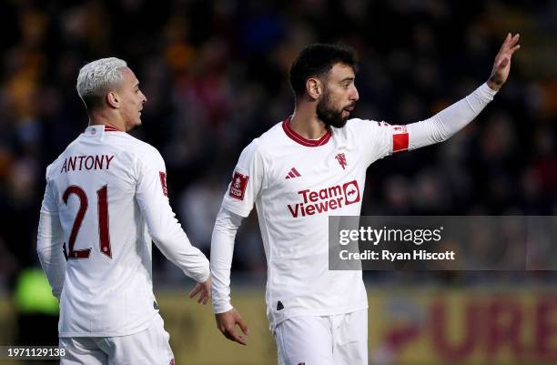 Bruno Fernandes of Manchester United celebrates scoring his team's first goal with teammate Antony during the Emirates FA Cup Fourth Round match...