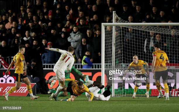 Rasmus Hojlund of Manchester United scores his team's fourth goal during the Emirates FA Cup Fourth Round match between Newport County and Manchester...