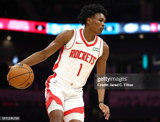 Amen Thompson of the Houston Rockets dribbles during the first quarter of the game against the Charlotte Hornets at Spectrum Center on January 26,...