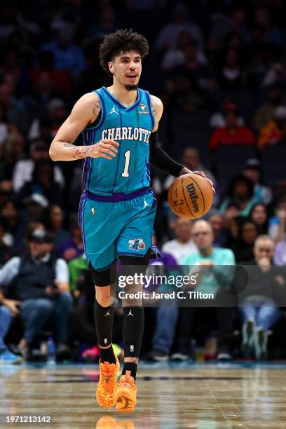 LaMelo Ball of the Charlotte Hornets brings the ball up court during the second half of the game against the Houston Rockets at Spectrum Center on...