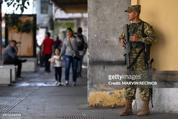 Soldier stand guard in the street in San Salvador, on February 1 ahead of Sunday's presidential and legislative elections.