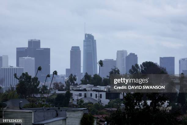 Downtown Los Angeles skyline is pictured during a rain storm in Los Angeles, California, on February 1, 2024. The US West Coast was getting drenched...